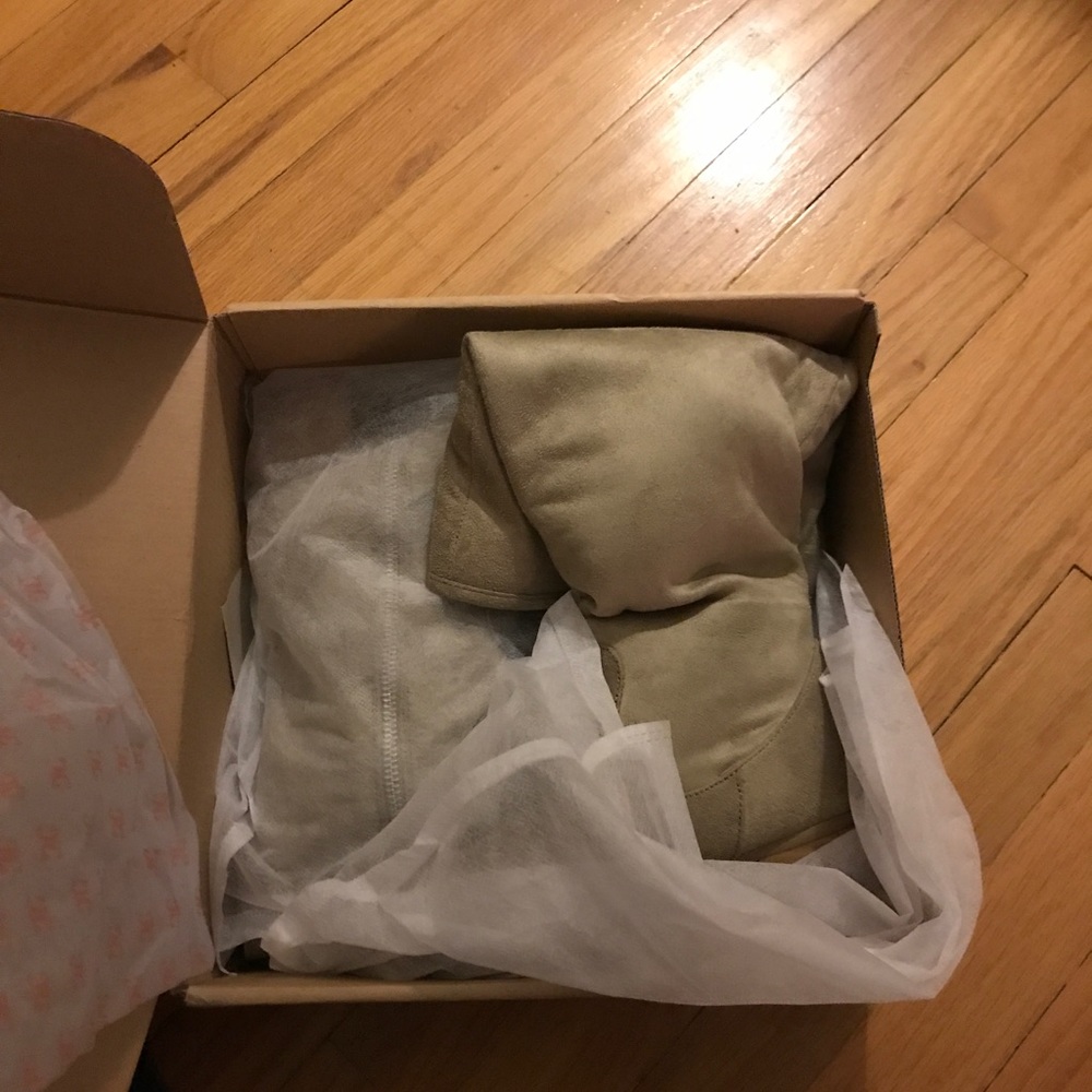 Taupe/beige boots.